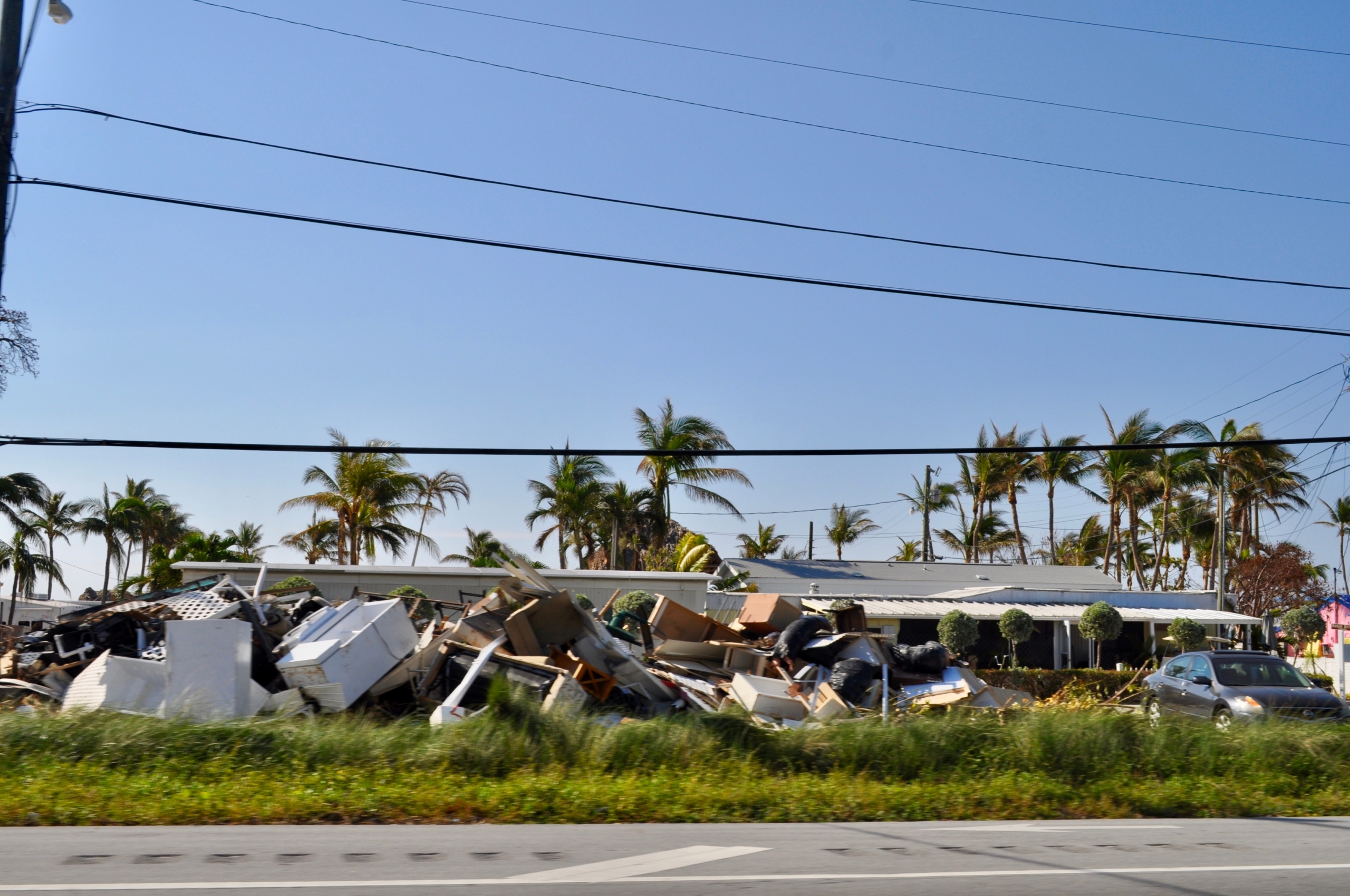 Dell'Armi Law-Hurricane Ian- Property Damage-piles-of-damaged-property-along-the-side-of-the-road